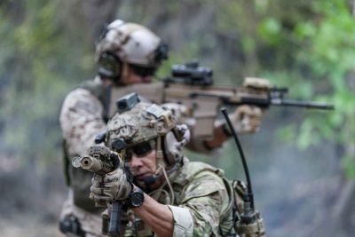 Soldiers,In,Tactical,Gear,Aiming,Guns,During,A,Military,Exercise,